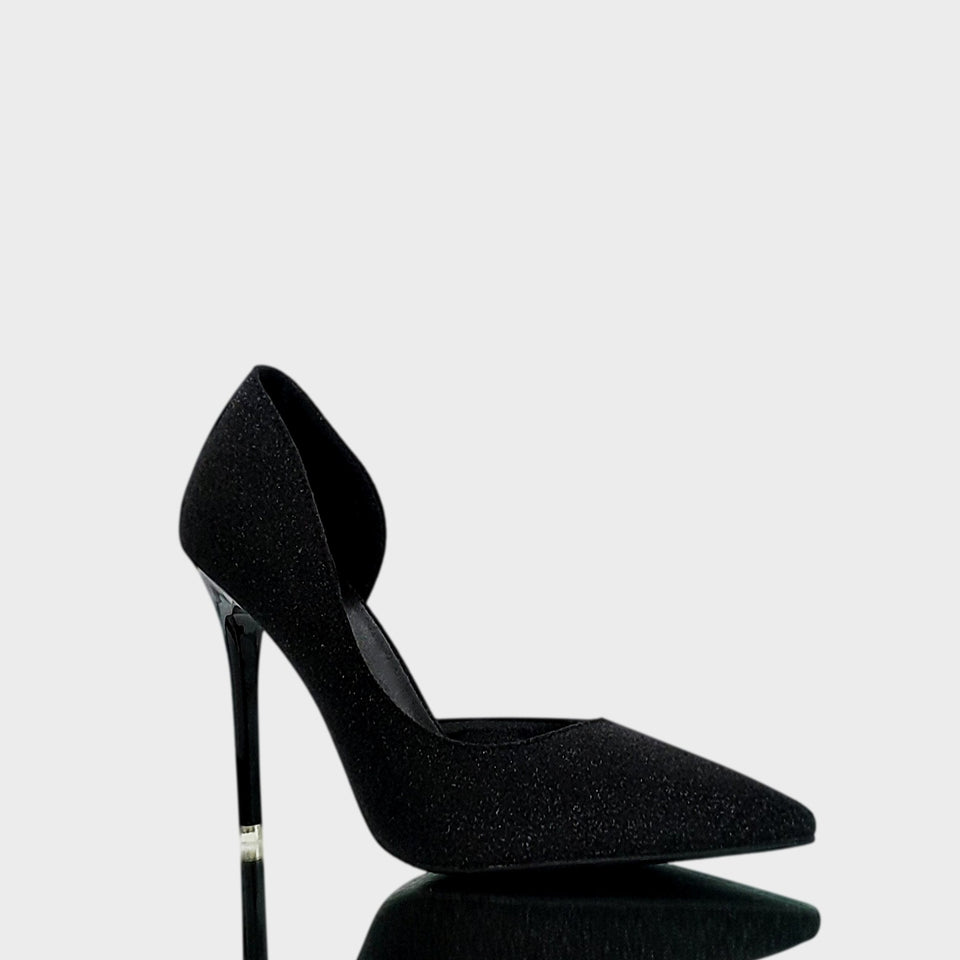 La chica de los stilettos Vista Lateral de Stilettos Ava Black Glint en Material Brillante Negro con Taco Acrílico al Tono de 10,5 cm